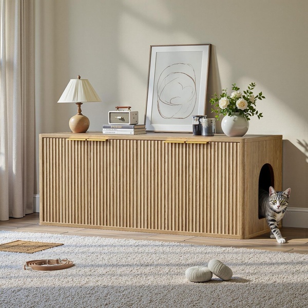 A high-end interior shot showing a sleek, ribbed wooden cabinet that functions as a hidden litter box, featuring a cat exiting the side.