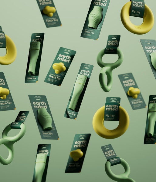 A minimalist, high-contrast product hero creative showcasing various dog toys floating against a uniform sage green background.