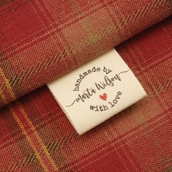 handmade clothing, artisan apparel, custom garments, handcrafted shirts, personalized clothing, made to order apparel, boutique clothing, brand awareness, minimalist, warm, trustworthy, red, neutral