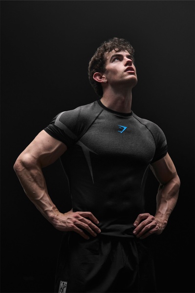 compression shirt, gym shirt, athletic top, short sleeve shirt, workout shirt, training top, brand awareness, lifestyle, bold, energetic, black, neutral