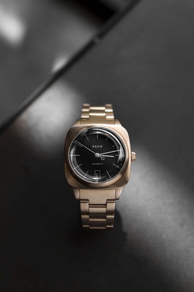 wrist watch, analog watch, automatic watch, metal watch, mens watch, minimalist, editorial, luxurious, calm, neutral, gold