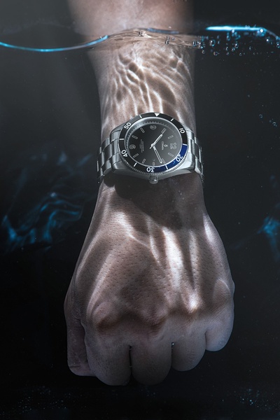 wrist watch, analog watch, dive watch, metal band watch, steel watch, product demo, lifestyle, luxurious, calm, blue, neutral