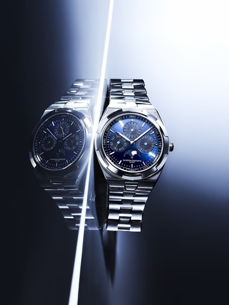 luxury watch, analog watch, stainless steel watch, chronograph watch, wrist watch, brand awareness, minimalist, editorial, luxurious, calm, blue, neutral, black