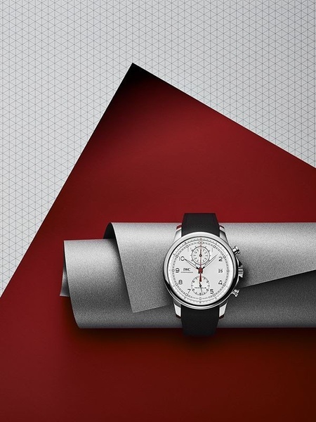 wrist watch, analog watch, luxury watch, chronograph watch, stainless steel watch, mens watch, brand awareness, minimalist, editorial, luxurious, bold, red, neutral