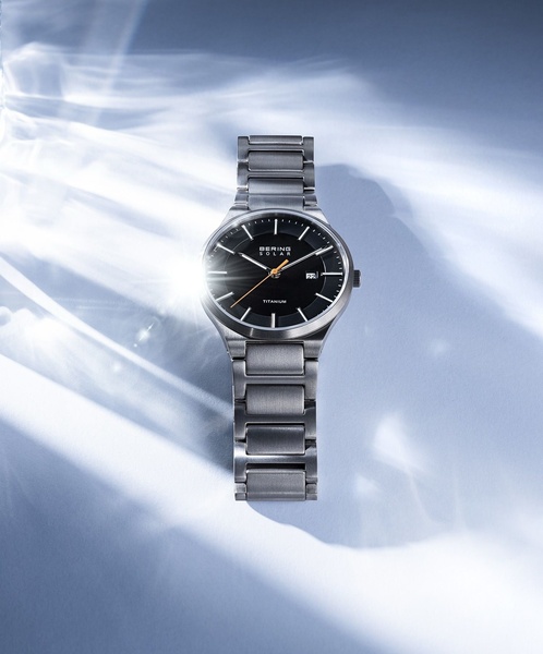 wrist watch, metal watch, analog watch, solar watch, titanium watch, brand awareness, minimalist, editorial, luxurious, calm, neutral, blue