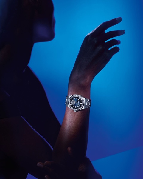 wristwatch, luxury watch, analog watch, stainless steel watch, jeweled watch, brand awareness, editorial, luxurious, calm, blue
