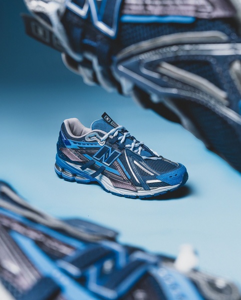 This ad creative displays a high-performance running shoe from multiple angles using a clean, monochromatic blue background to eliminate visual distractions.