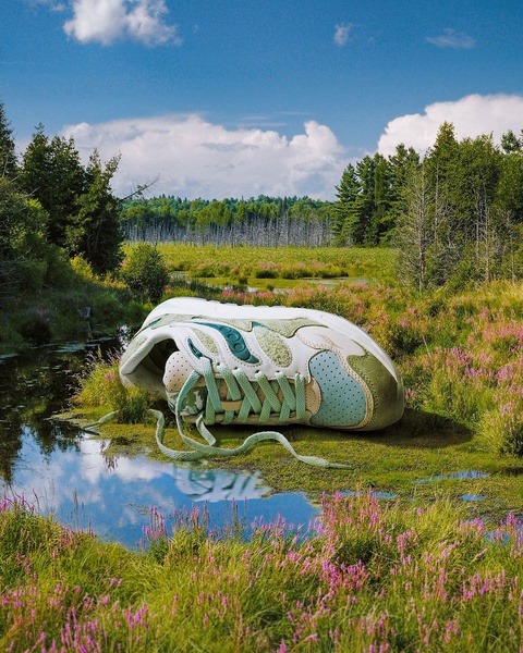 A high-quality studio-style product shot of a running shoe placed directly in a natural marsh landscape to evoke organic, high-performance themes.