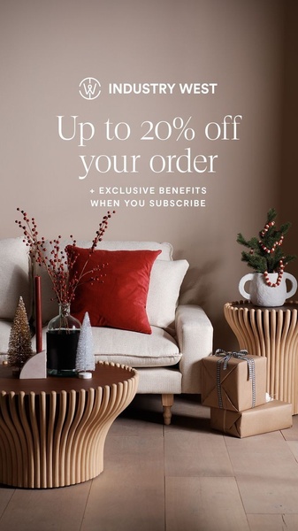 A cozy, holiday-themed lifestyle shot of living room furniture that promotes a 20% discount and subscription benefits to drive conversion.