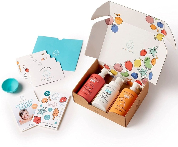This creative showcases a complete Kids Body Wash kit in an organized, flat-lay studio arrangement highlighting all included components.