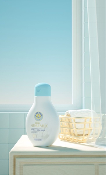 A clean, bright studio-style shot of a bottle of baby shampoo and body wash placed on a light-colored surface near a window.