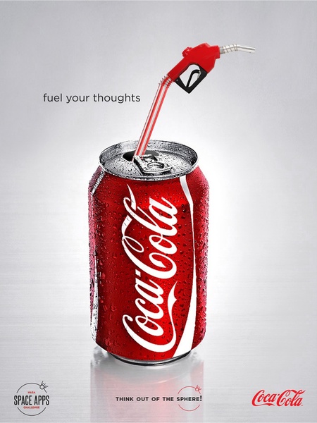 A high-contrast advertisement featuring a standard soda can being refueled with a gas pump nozzle to visually represent a source of energy.