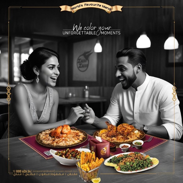 A high-contrast advertisement showing a couple sharing a traditional Mandi meal, using black and white photography to make the warm-colored food items pop.