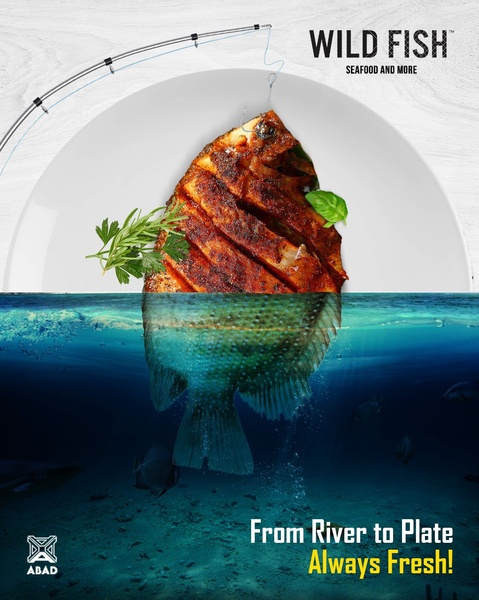 A split-level creative showing a cooked fish on a plate above the water and the raw fish swimming below, highlighting freshness.