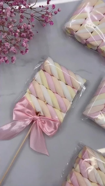 marshmallow pop, candy skewer, marshmallow treat, party candy, decorated marshmallow, gift guide, flat lay, calm, playful, pastel, neutral