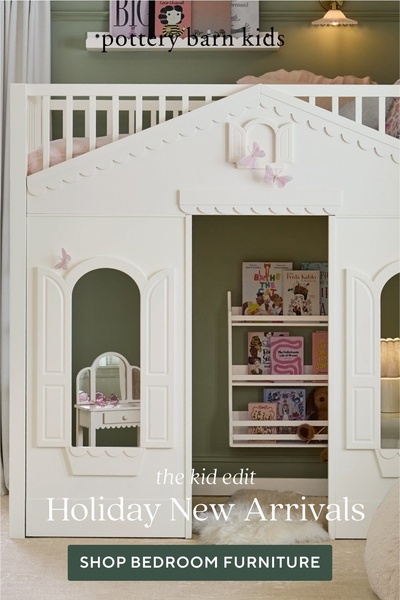 A clean, lifestyle-focused image showcasing a white wooden playhouse-style loft bed for children, emphasizing a cozy and organized bedroom environment.
