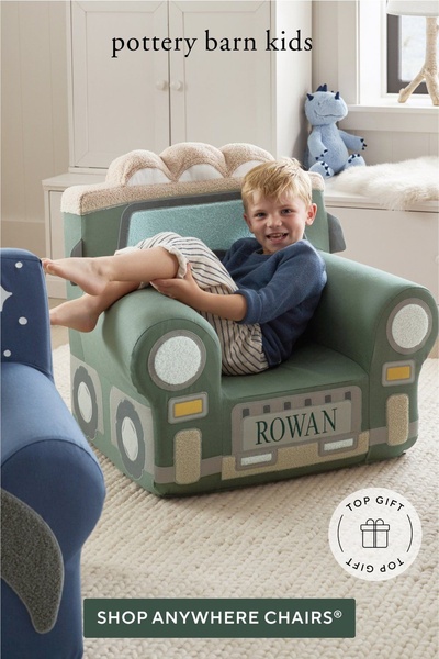A high-quality lifestyle shot featuring a child sitting in a personalized, custom-shaped Anywhere Chair, highlighting both comfort and unique product branding.