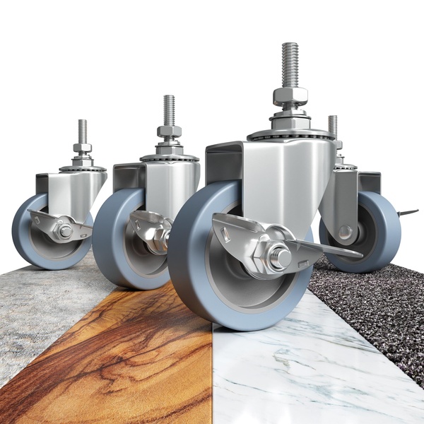 This creative showcases four industrial caster wheels positioned on distinct floor textures to visually communicate durability and versatility.