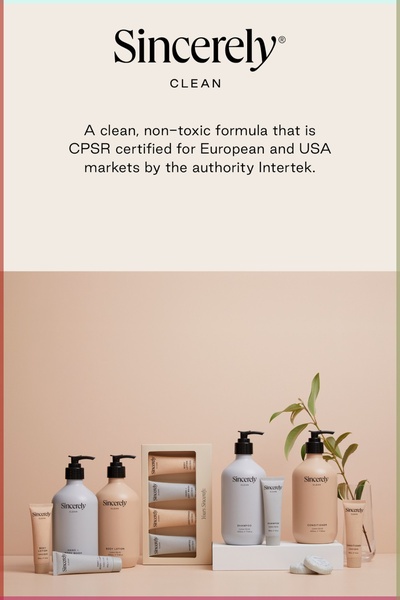 This static creative showcases a full collection of skin care bottles and tubes arranged neatly in a studio setting, emphasizing product range and clean credentials.