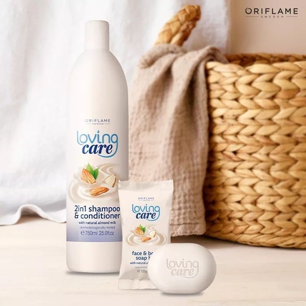 A clean, lifestyle-oriented display featuring a 2-in-1 shampoo and conditioner bottle alongside soap products, set against a soft, rustic background.
