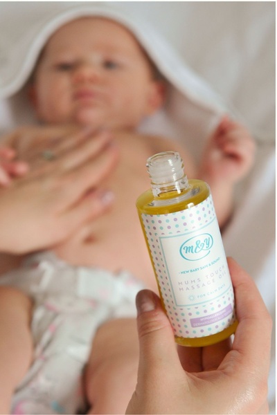 baby massage oil, infant body oil, baby skincare, massage oil, baby grooming product, product demo, lifestyle, calm, warm, neutral, pastel