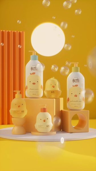 A clean, studio-lit display of a baby shampoo and conditioner product line, accented by playful soap bubbles and a warm, cohesive color palette.