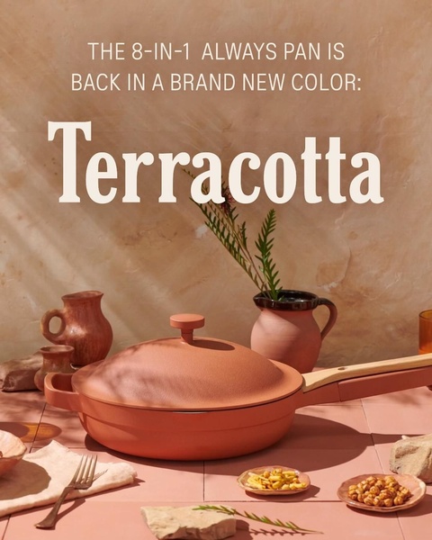 A clean, lifestyle-focused advertisement for a cooking pan, showcasing a new terracotta color against a matching background to evoke a premium aesthetic.