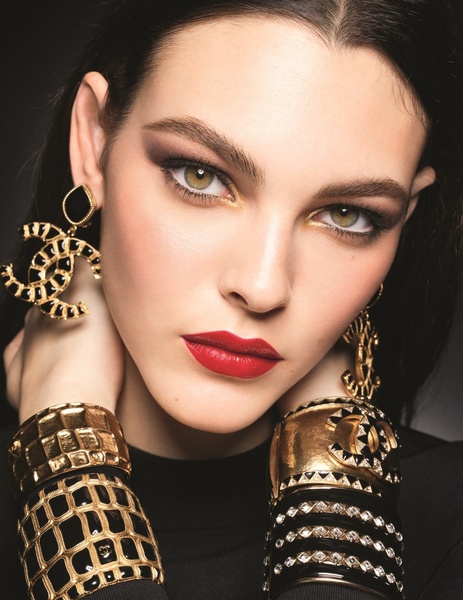 A high-end macro portrait showcasing statement jewelry on a model to emphasize luxury, premium materials, and brand sophistication.