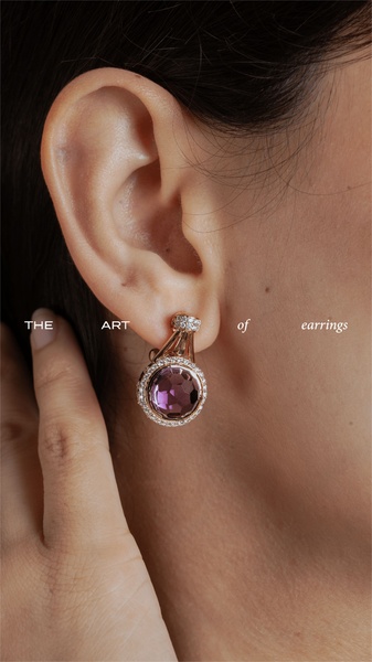 A close-up, high-detail macro shot of a single elegant earring on a model, focusing on texture and light.