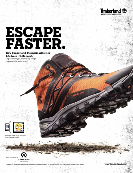 A high-angle studio shot of a hiking shoe kicking up dirt to emphasize durability and lightweight performance.