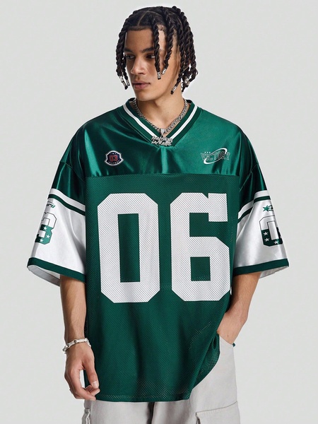 A high-quality, studio-lit portrait featuring a model in a branded green football-style jersey, emphasizing clean aesthetics and streetwear branding.