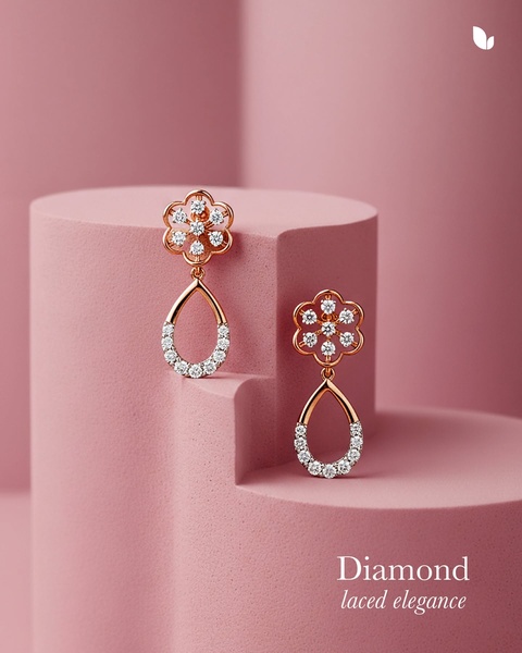 A high-end, clean product shot of rose gold diamond-encrusted earrings presented on a geometric, soft-pink studio pedestal.