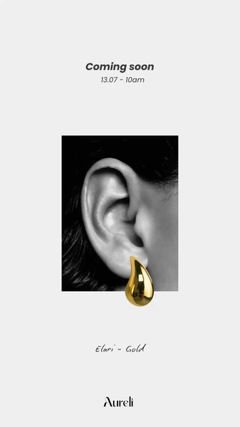 A high-contrast, minimalist teaser creative for a gold earring featuring a monochromatic ear close-up and a single golden product shot.