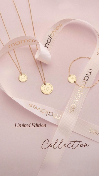 A high-end, soft-toned presentation of personalized gold necklaces and bracelets draped elegantly with brand-printed ribbons.
