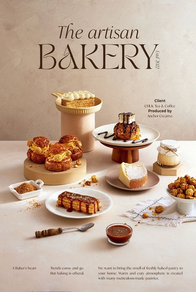 A high-end product display showcasing various pastries and desserts, focusing on warm tones and meticulous table styling.