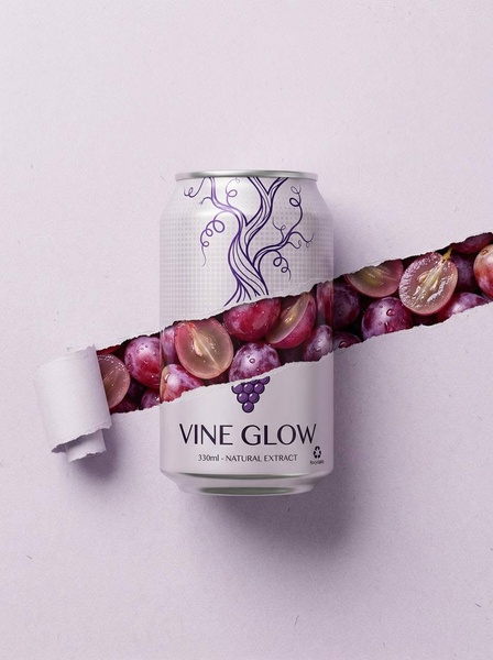 A high-fidelity product render of a grape juice can featuring a torn-paper effect that reveals fresh grapes inside the packaging.