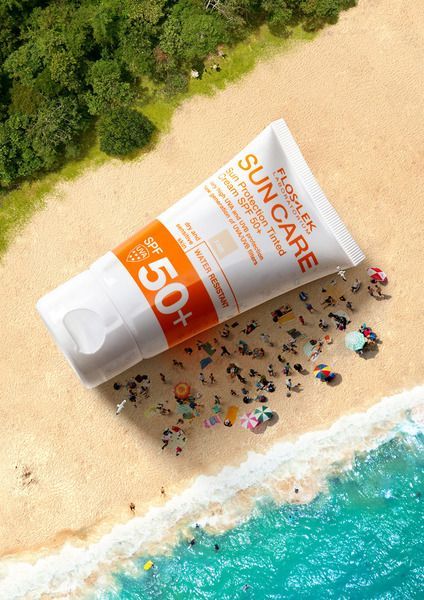 An aerial perspective shows a giant tube of sunscreen lotion resting on a beach, surrounded by tiny people enjoying the sun.