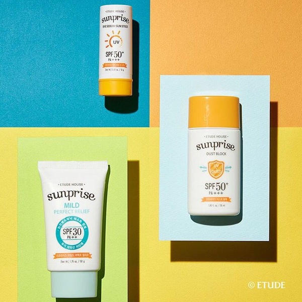 A vibrant, 1:1 square creative featuring three sunscreen products arranged on a split-color, geometric background.