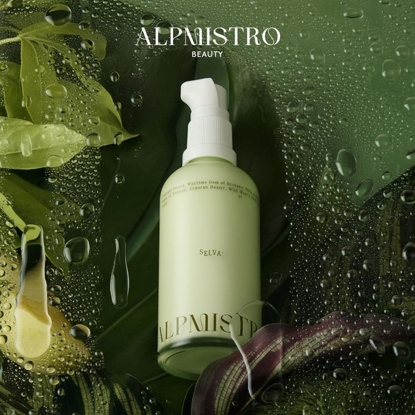 A high-end skin care bottle placed among lush, wet leaves to convey natural freshness and premium product quality.