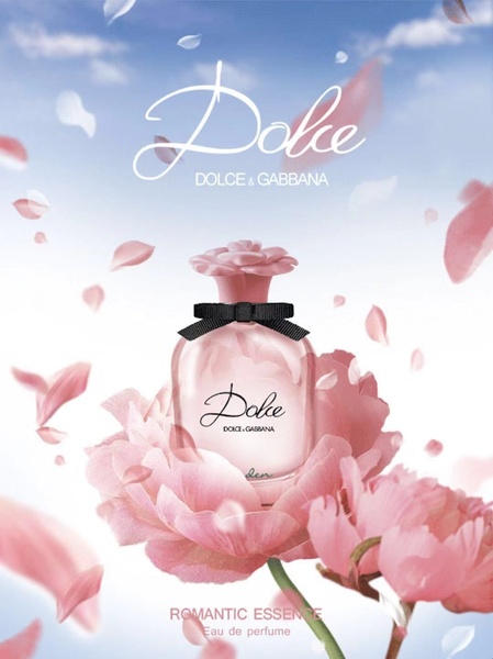 A high-end product hero shot of a perfume bottle nestled in soft pink petals against a dreamy, sunny sky backdrop.
