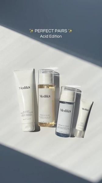 A clean, minimalist studio shot showcasing four skincare bottles in a 9:16 vertical format, emphasizing a 'Perfect Pairs' product grouping strategy.