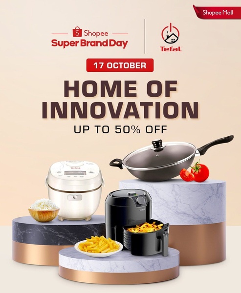 A polished, platform-native advertisement showcasing a rice cooker and air fryer on tiered pedestals, highlighting a 50% discount for a brand event.