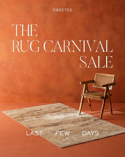 A high-end, minimalist advertisement for a rug sale featuring warm, earthy tones and a single wooden chair, emphasizing a sense of urgency.