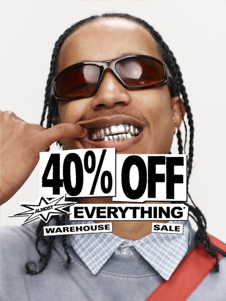 A close-up portrait featuring a person wearing grillz, highlighting a 40% off sale offer with bold typography.