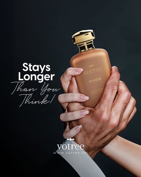 A close-up, high-contrast shot of a perfume bottle held between two hands, emphasizing quality and lasting impact.