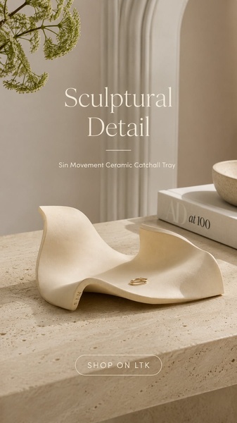 A high-end, minimalist product hero shot of a ceramic catchall tray on a stone surface, emphasizing its unique shape and texture.