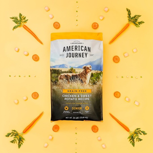 This creative uses a symmetrical flat lay of fresh vegetables surrounding a central bag of senior dog food to emphasize natural, high-quality ingredients.