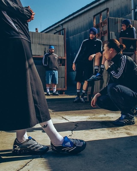 A group of models in industrial settings showcase athletic footwear, emphasizing lifestyle integration rather than pure product functionality.