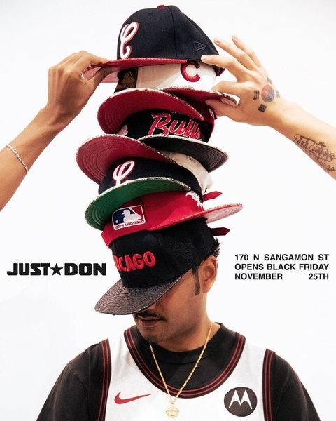 A striking studio-style image featuring a person balancing a stack of baseball caps on their head, showcasing a collection with bold branding.