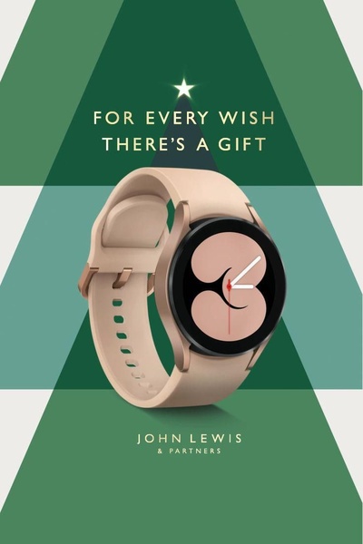 A minimalist, holiday-themed creative featuring a smartwatch centered against a stylized green evergreen tree background.